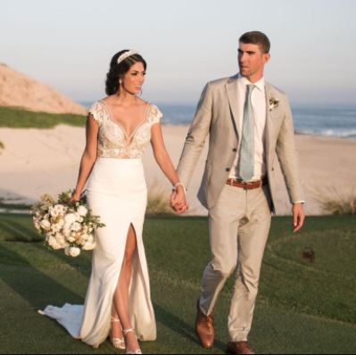 Beckett Richard Phelps's parents Michael Phelps and Nicole Johnson at their wedding